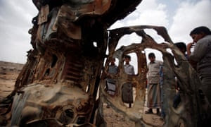 Boys gather near the wreckage of car destroyed by a US drone airstrike targeting suspected al-Qaida militants in Azan, Yemen, in 2013.
