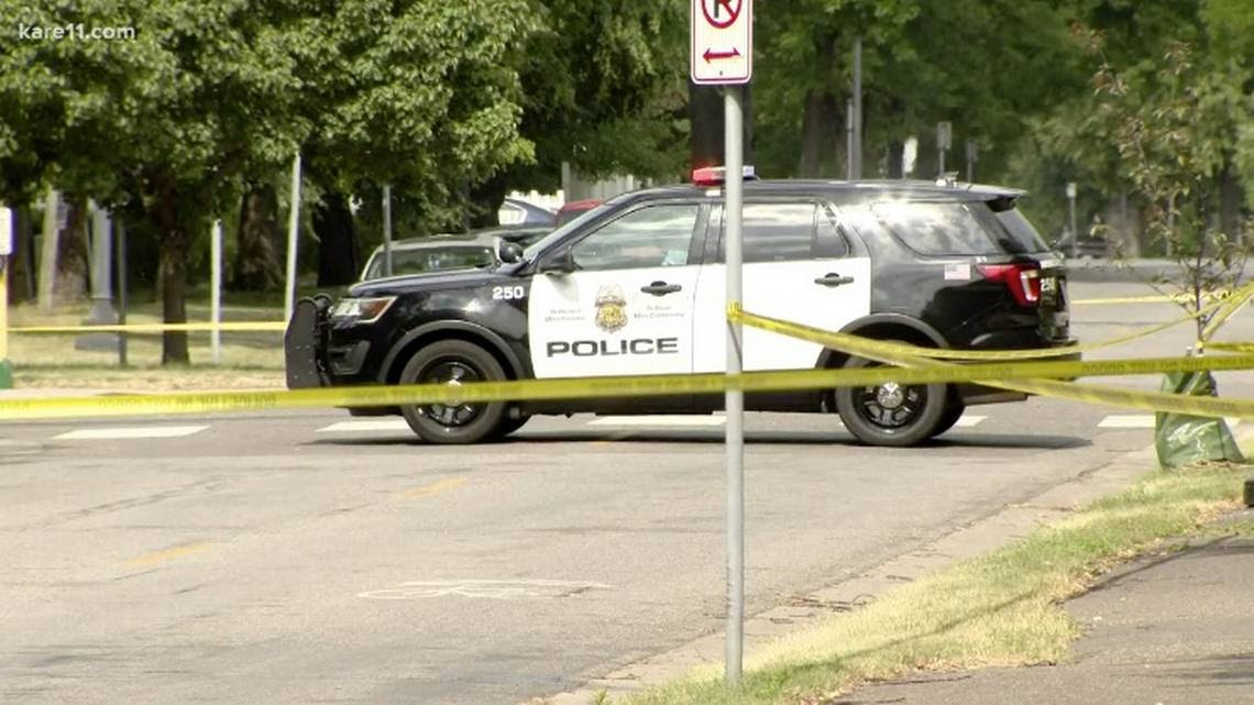 Caution tape sections off an area with a police car