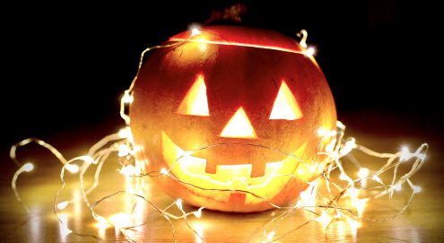 Jack-o-Lantern Wrapped in String of Lights