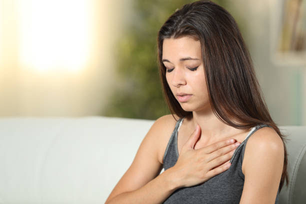 https://media.istockphoto.com/id/1214455854/photo/girl-having-respiration-problems-touching-chest.jpg?s=612x612&w=0&k=20&c=0Kaqe5HizOqNyKp3LkuU4GSBUwLh5zMAvMHu4tdKlZQ=