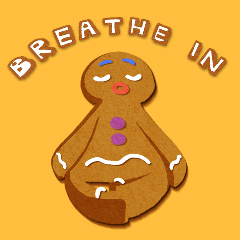 Image of a gingerbread man with the words "breathe in breathe out" written