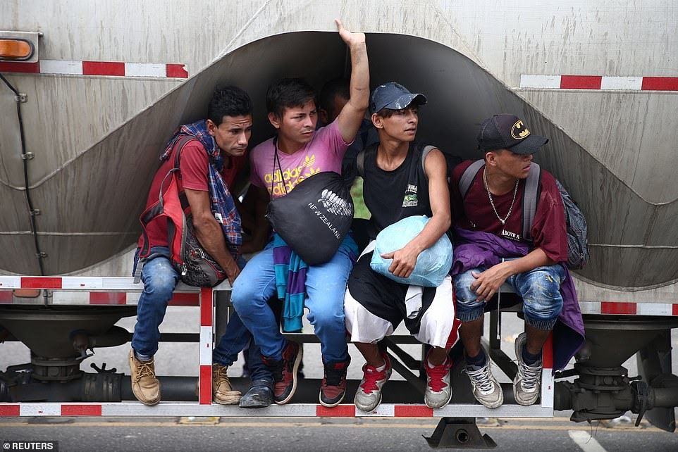 Honduran migrants, part of a caravan trying to reach the U.S.,