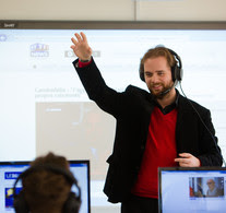 Image of lecturer delivering to students in a language lab.