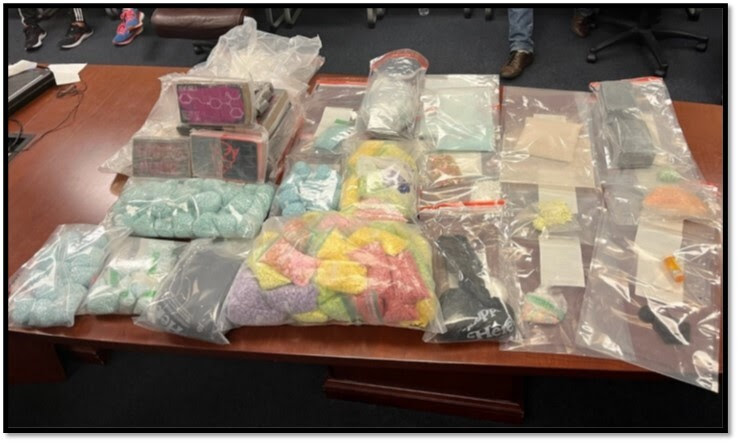 Photo of narcotics and other items recovered during the search of the fentanyl mill