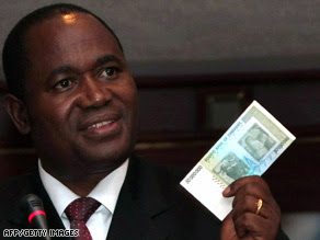 Zimbabwe central bank governor Gideon Gono shows a new $50 million note Thursday.