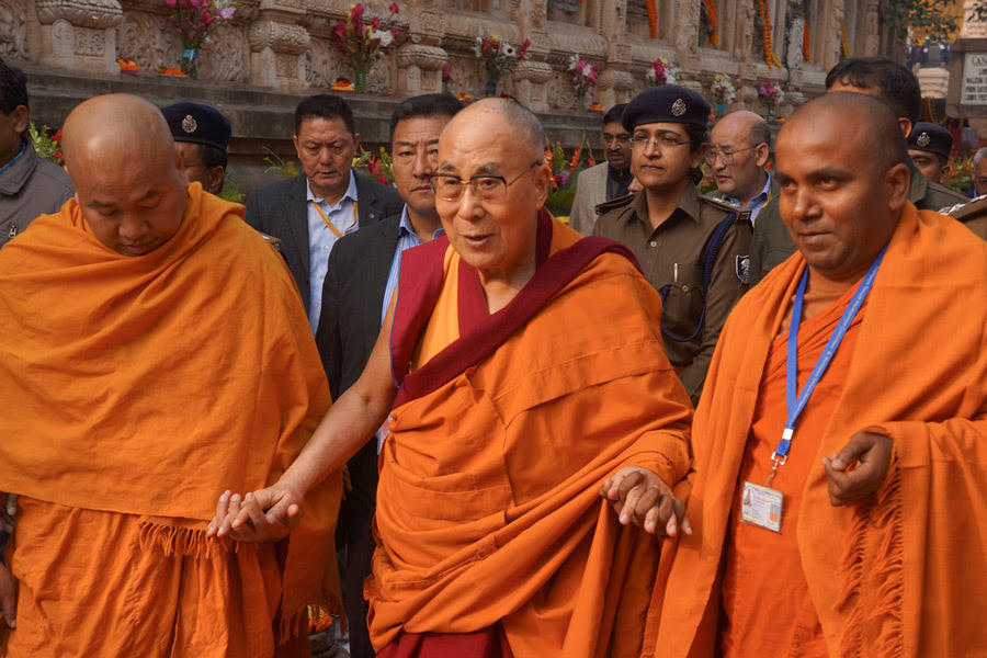 Two monks from the Mahabodhi Society escorting His Holiness the Dalai Lama around the Mahabodhi Temple in Bodhgaya, Bihar, India on December 29, 2016. Photo/Jeremy Russell/OHHDL