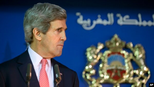 U.S. Secretary of State John Kerry listens during a news conference with Moroccan Foreign Minister Salaheddine Mezouar at a U.S.-Morocco Strategic Dialogue at the Ministry of Foreign Affairs in Rabat, Morocco, April 4, 2014. 