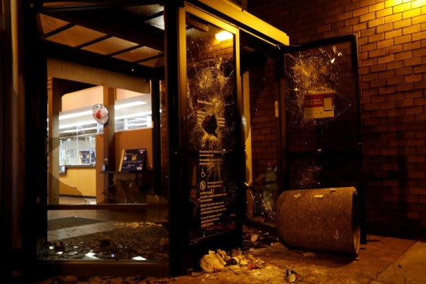 A vandalized Bank of America office is seen after a student protest turned violent at UC Berkeley during a demonstration over right-wing speaker Milo Yiannopoulos in Berkeley (REUTERS)