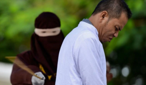 Indonesia: Muslim cleric publicly flogged for adultery under islamic law he helped draw up