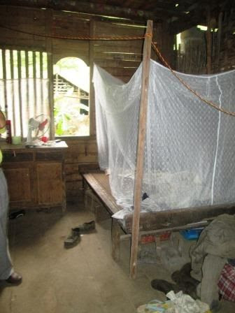 The houses are open to the weather, so they sleep with mosquito nets.