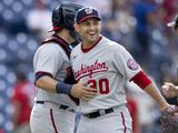 Washington Nationals closing pitcher Paolo Espino, right, celebrates with catcher Alex Avila, left, after the Nationals defeated the Philadelphia Phillies in a baseball game, Wednesday, June 23, 2021, in Philadelphia. (AP Photo/Laurence Kesterson)