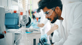 Photo of young doctor conducting research in a lab