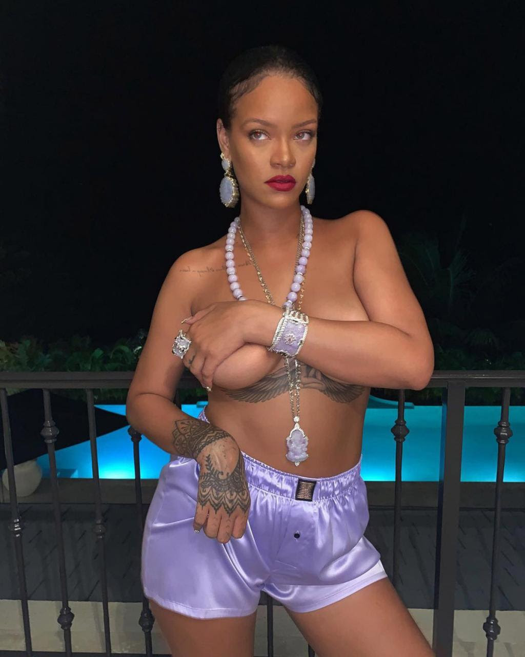 Rihanna poses topless in sexy poolside snap