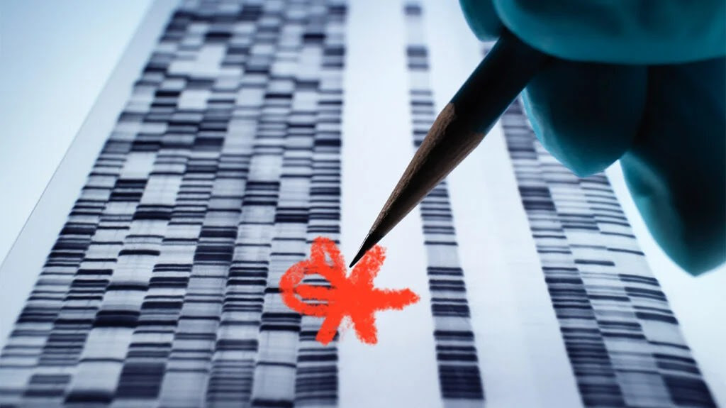 gloved hand holding a pencil marking genetic sequence on paper