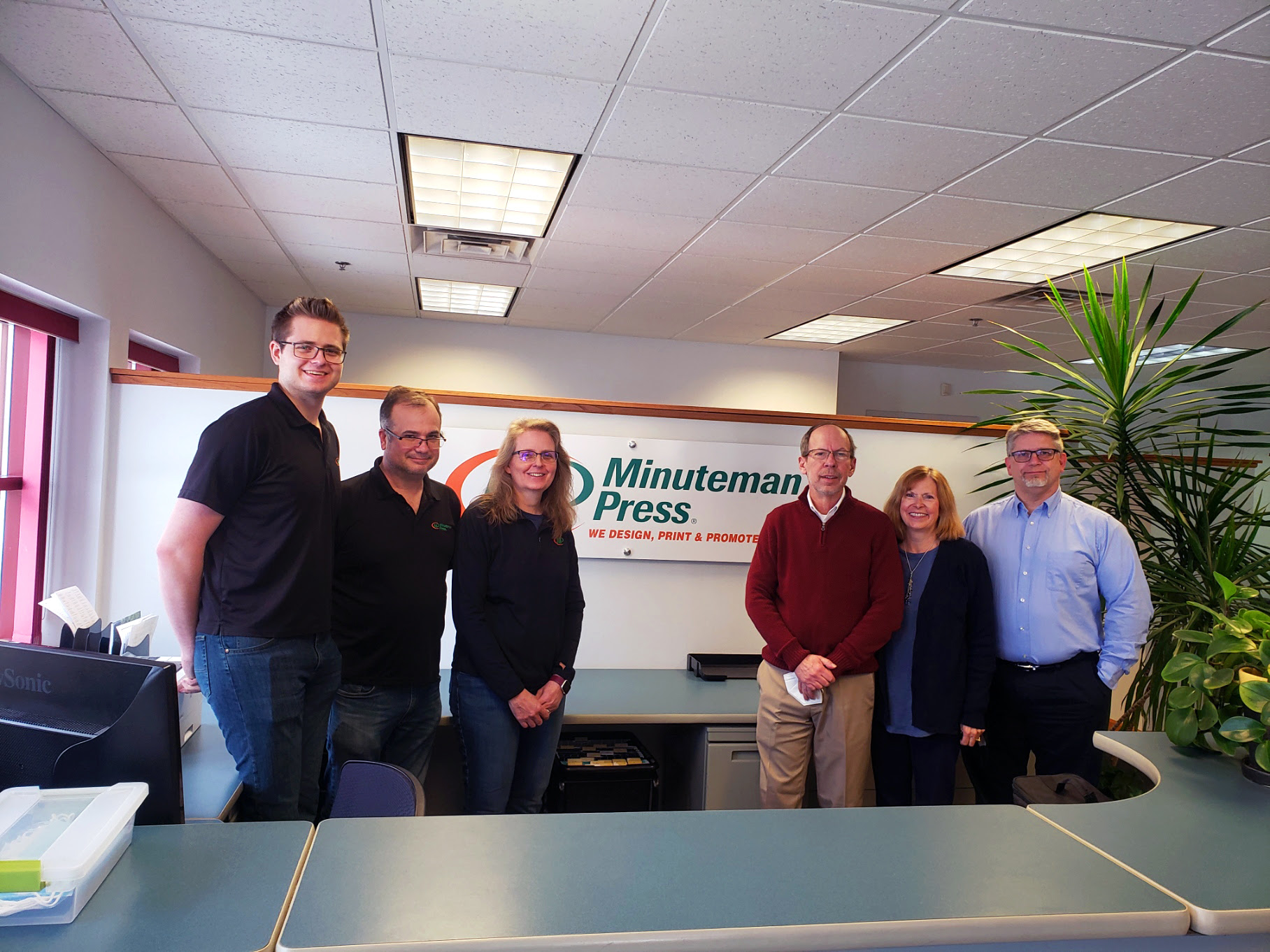 SprintPrint is now Minuteman Press, Madison, WI. Pictured left to right: CJ Kenney, Chrispin Kenney, Lynn Kenney, Phil Van Kampen, Liz Van Kampen, and Chris Malchow.