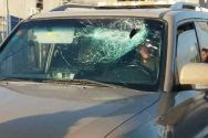 Windshield smashed by rock-throwers.