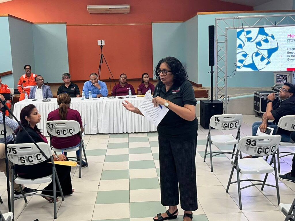 Heritage CEO Arlene Chow speaks to Guayaguayare residents and fisherfolk on March 9 about what the company is doing to clean up a recent oil spill. - Photo courtesy Heritage