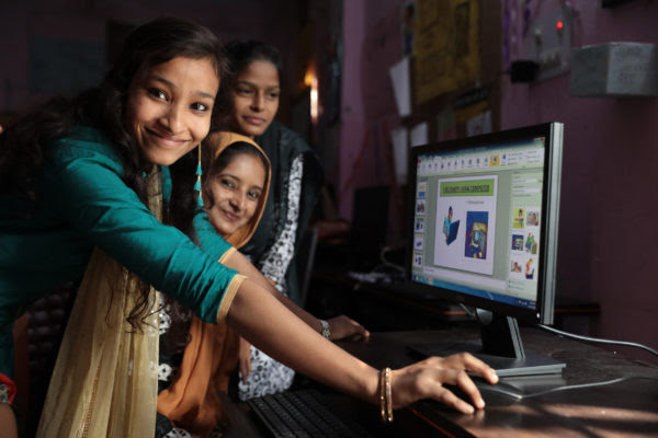 young women in India at a computer