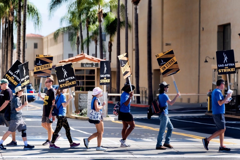 SAG-AFTRA and the Hollywood studios reached a tentative agreement to end the actors' strike 231003-sag-strike-al-1011-b8fee8