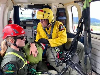 Two Forest Rangers in helicopter