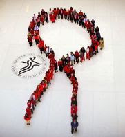 HRSA and HHS staff form a human ribbon in observance of World AIDS Day