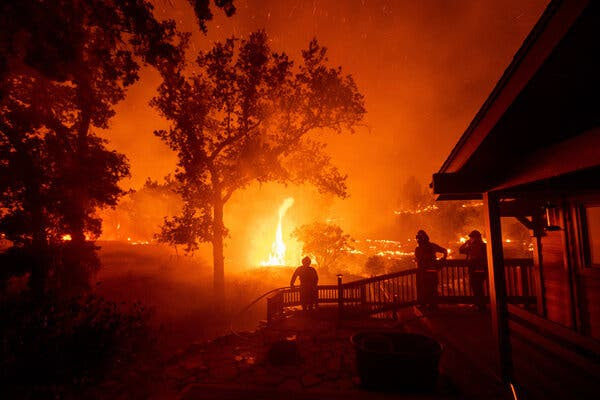 Firefighters watched the LNU Lightning Complex fire from a home in Napa County in August.