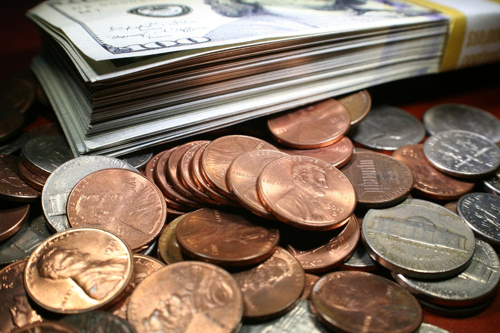 A pile of bills and coins