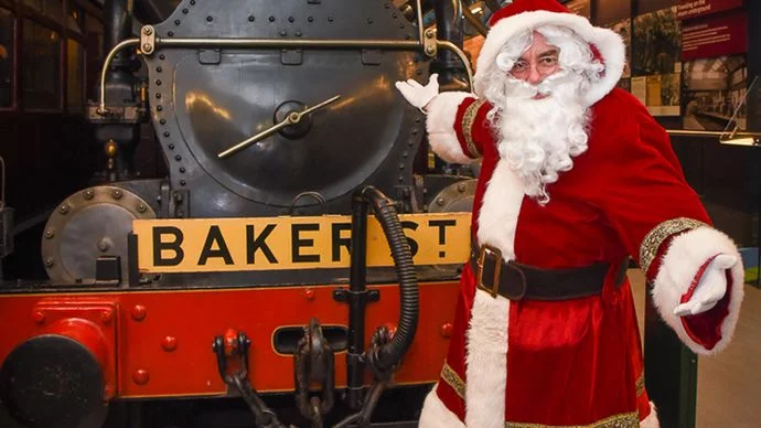 Santa in front of a train