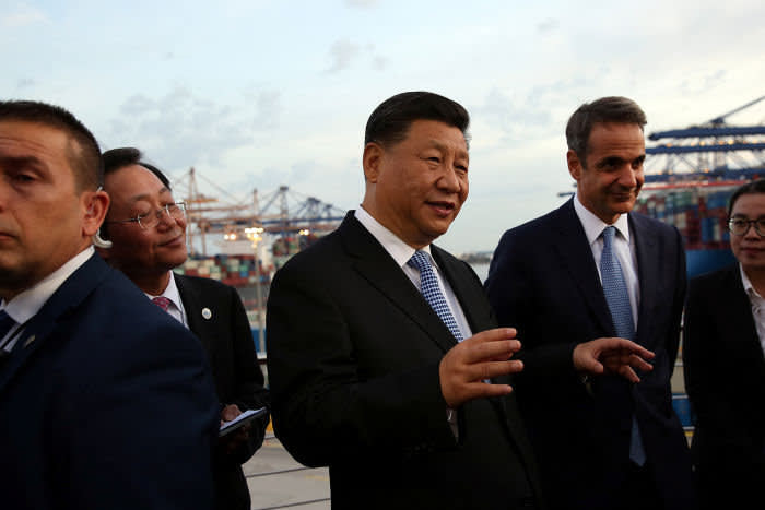 Chinese President Xi Jinping and Greek Prime Minister Kyriakos Mitsotakis visit the container terminal of China Ocean Shipping Company (COSCO), in Piraeus, Greece November 11, 2019. Orestis Panagiotou/Pool via REUTERS - RC249D9ECNG2