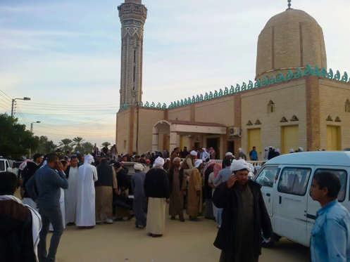 Slide 3 of 6: AL ARISH, EGYPT - NOVEMBER 24:  People gather at the site of the Egypt Sinai mosque bombing in Al-Arish, Egypt on November 24, 2017. The death toll from a bomb that went off outside a mosque in the city of Al-Arish in the northern Sinai Peninsula following Friday prayers has climbed to a whopping 235, according to official sources. At least 109 others were injured in the blast, which occurred in the citys Al-Rawda neighborhood.   (Photo by Stringer/Anadolu Agency/Getty Images)