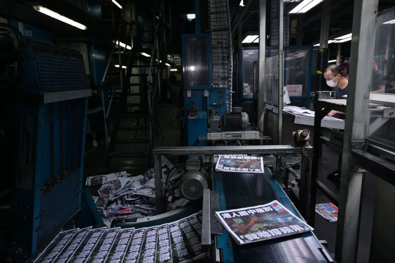 Apple Daily employees work in the printing room on the last edition of the newspaper, in Hong Kong on June 24.