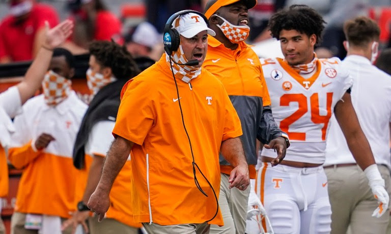 Jeremy Pruitt on the sideline coaching Tennessee against Georgia
