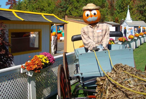 Friendly painted pumpkins welcome visitors to the Pumpkin Town USA drive-thru