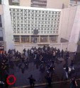 Jews inside Paris synagogue surrounded by protesters throwing rocks, holding bats and chairs.