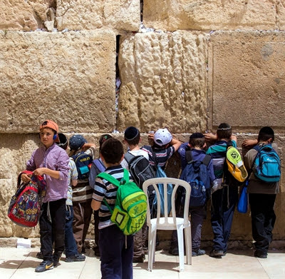 Jewish boys pray at the Western (Wailing)
              Wall.